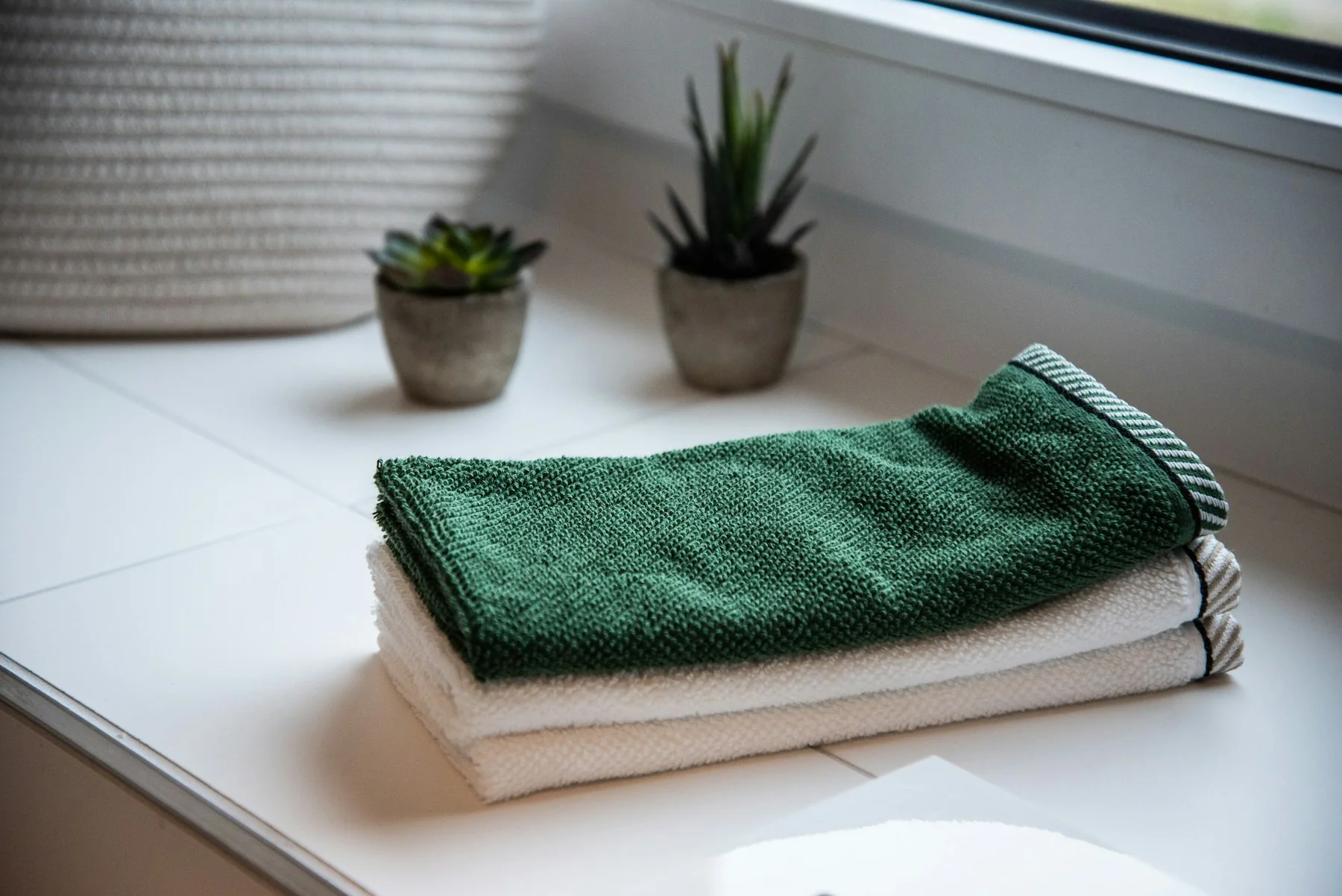 Folded towels in a refined bathroom setting